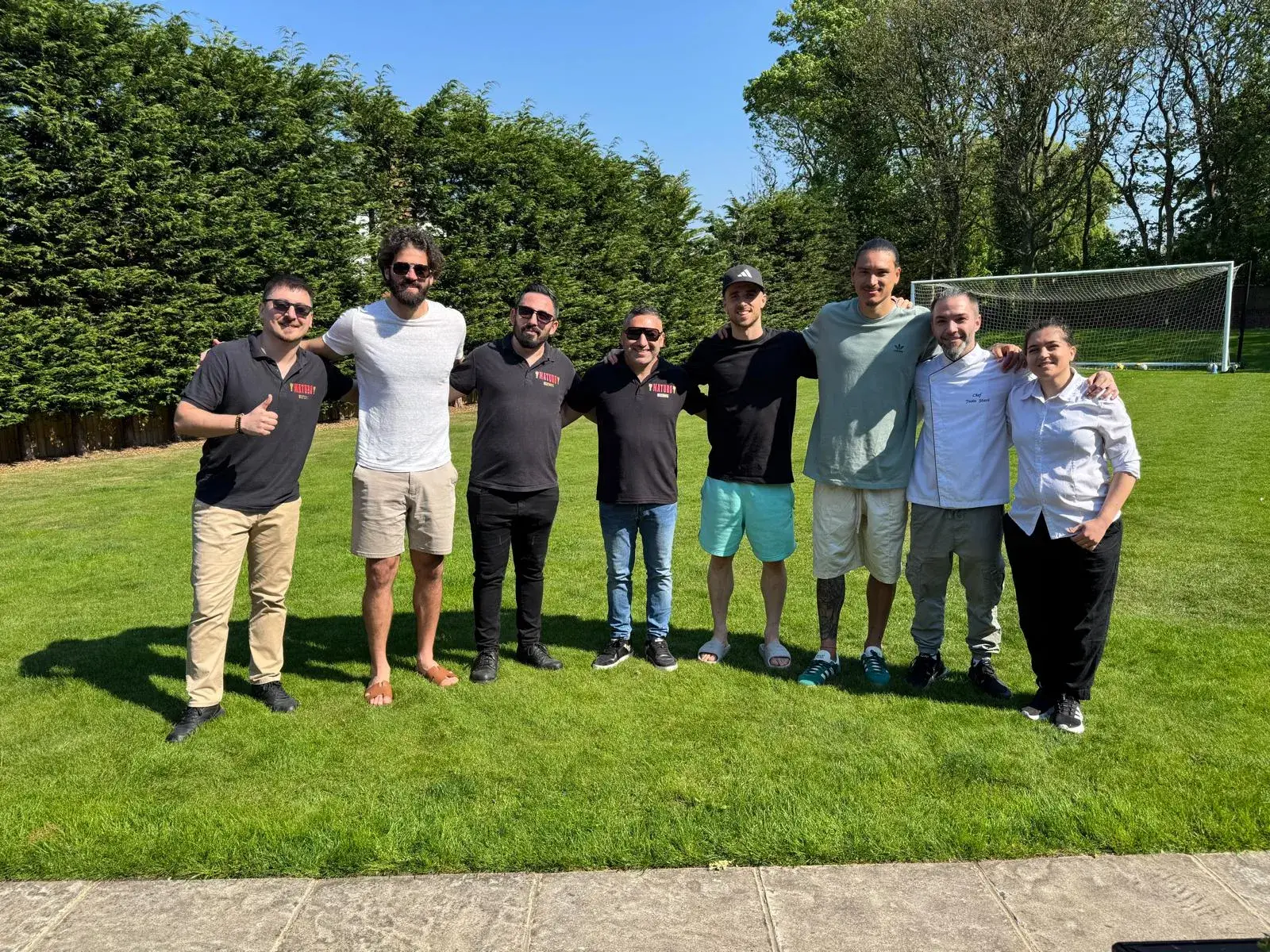 Okan Events team with guests at a private outdoor gathering