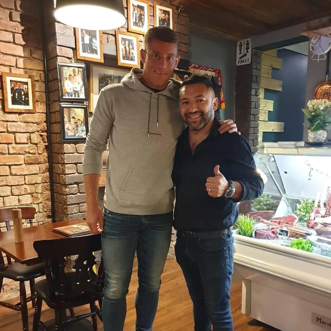 Guest with Okan Events in a steakhouse setting
