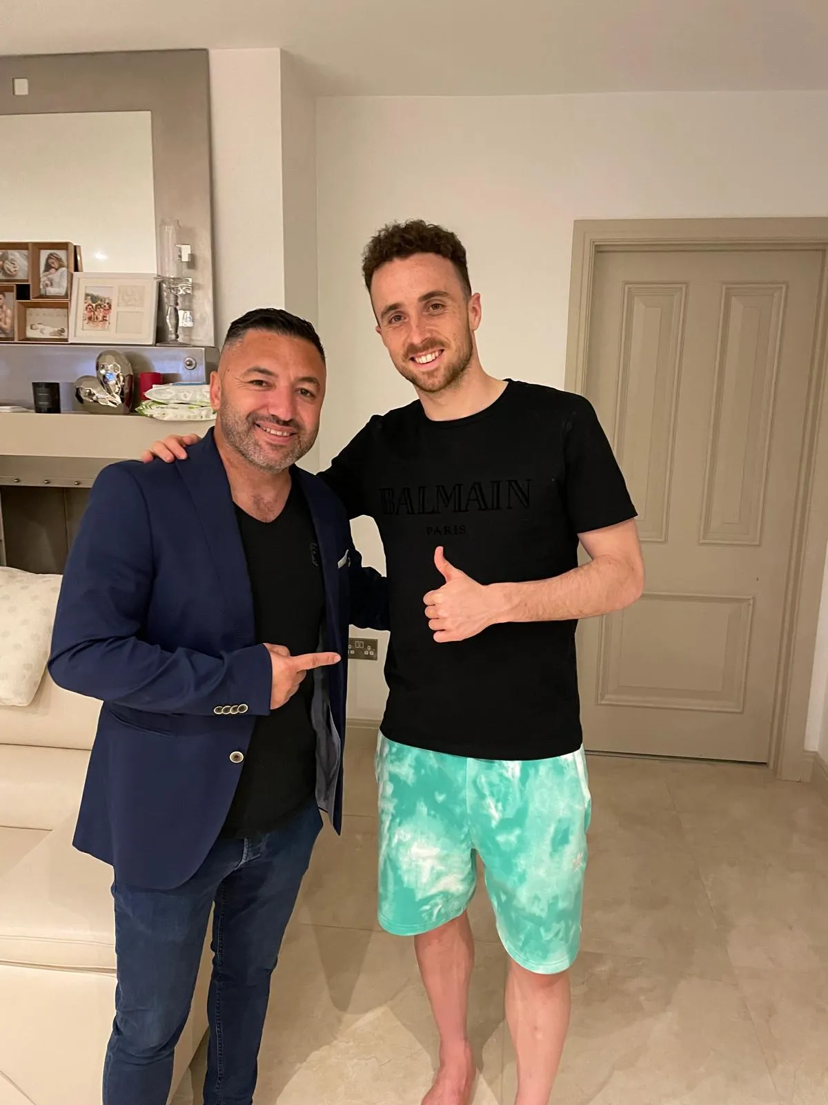 Okan Events host with a guest at a private home gathering
