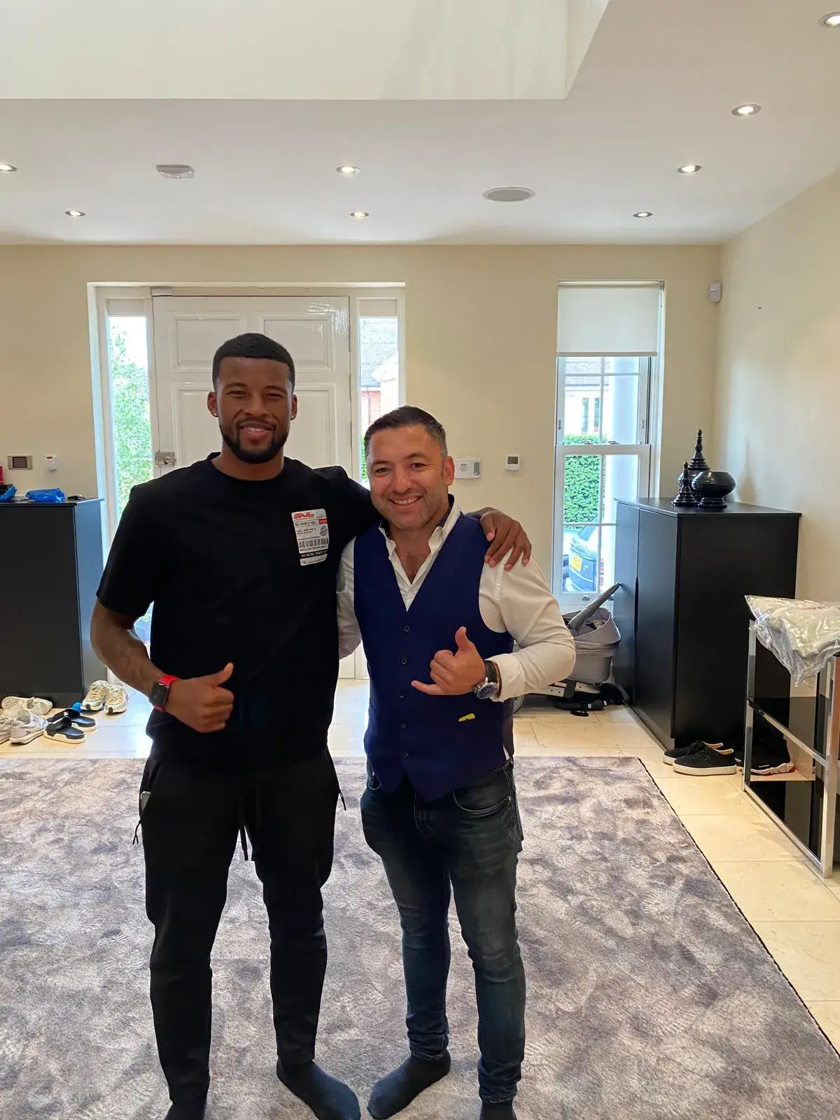 Okan Events host with a guest at a private residence