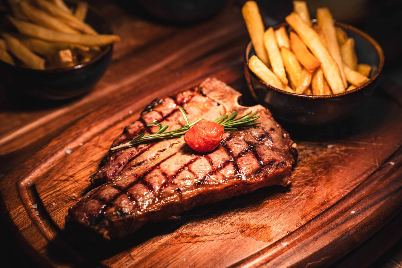 Grilled steak served with chips at Maturo Prescot